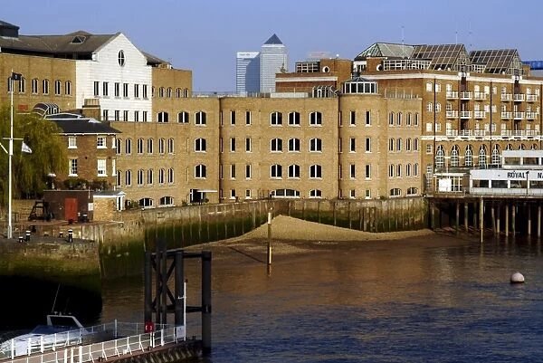 Converted wharves alongside the River Thames, Docklands, London, England