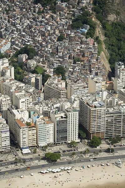 Copacabana Beach, neighbourhood and the Morro da Humaita favela behind, Rio de Janeiro