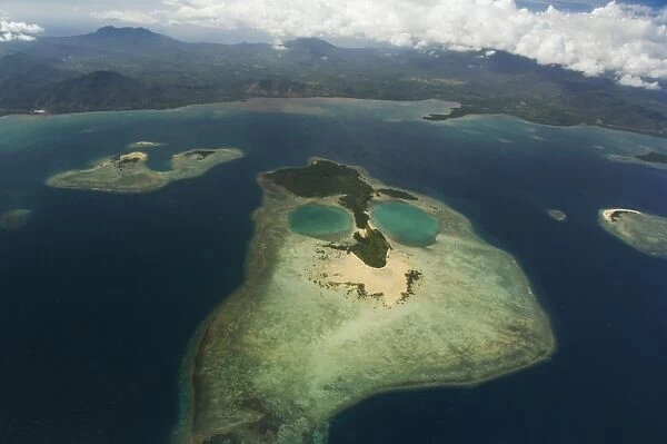 Coral island in shape of a face near Puerto Princesa