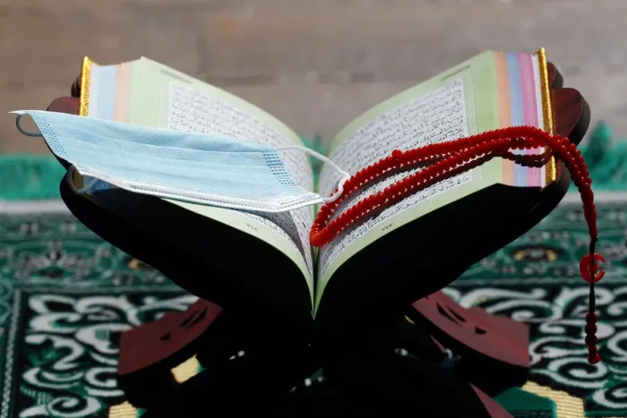 Framed Print : Coronavirus (COVID-19) epidemic, an open Holy Quran, Muslim prayer beads and a mask Framed Print : Coronavirus (COVID-19) epidemic, an open Holy Quran, Muslim prayer beads and a mask