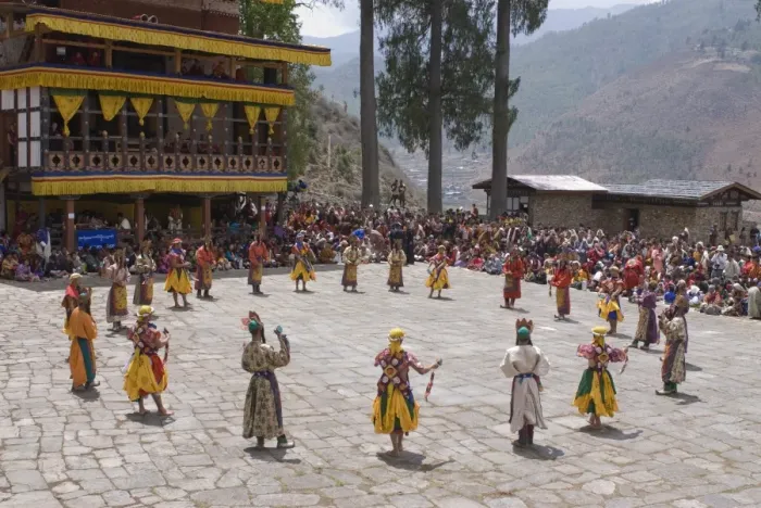Framed Print : Costumed dancers at religious festival with many visitors, Paro Tsechu