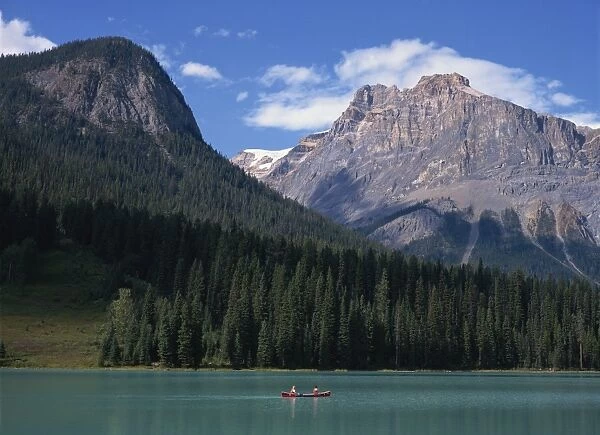 Couple in a canoe on Emerald Lake in the Rocky Mountains in British Columbia