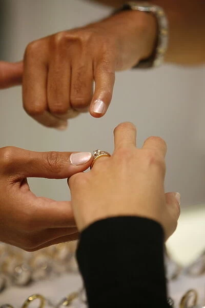 Couple choosing a wedding ring, Paris, France, Europe