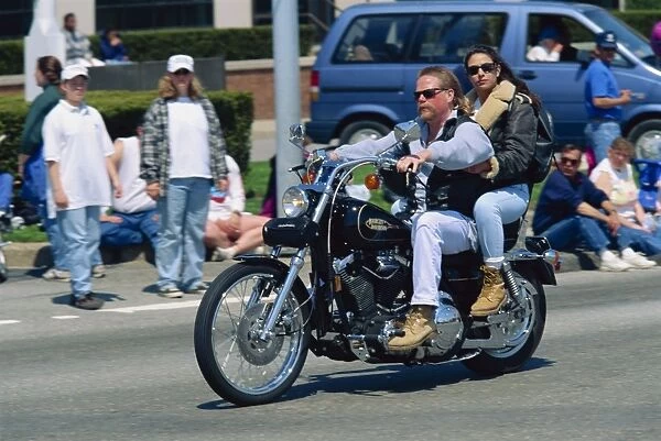 Couple on a Harley Davidson motorbike in Newport