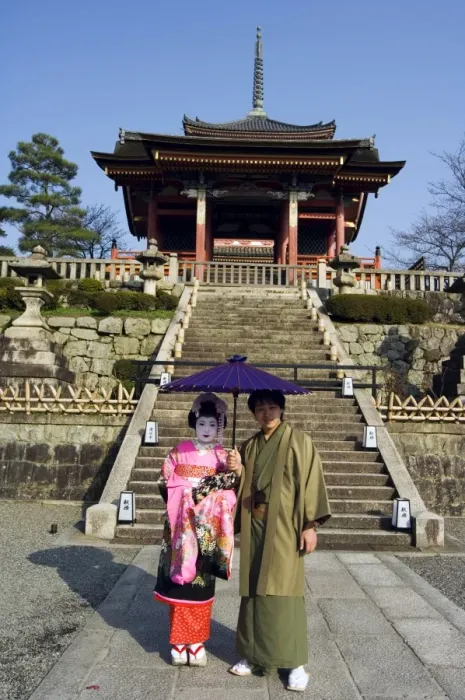 Framed Print : Couple holding parasol Framed Print : Couple holding parasol