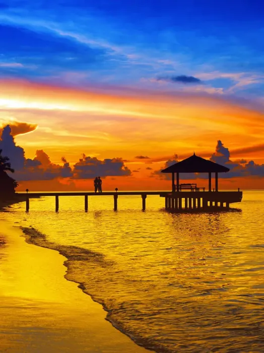 Framed Print : Couple on jetty looking at sunset, The Maldives, Indian Ocean, Asia Framed Print : Couple on jetty looking at sunset, The Maldives, Indian Ocean, Asia