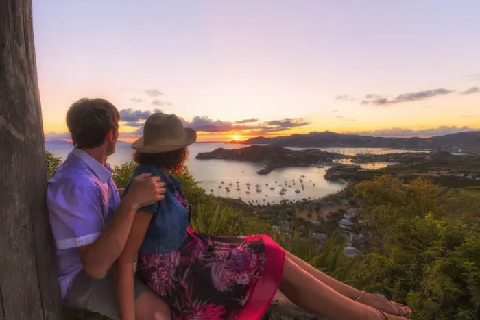 Framed Print : Couple look to the English Harbor from Shirley Heights at sunset, Antigua, Antigua and Barbuda Framed Print : Couple look to the English Harbor from Shirley Heights at sunset, Antigua, Antigua and Barbuda