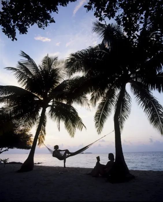 Framed Print : Couple relaxing on a beach at sunset, Maldives, Indian Ocean, Asia Framed Print : Couple relaxing on a beach at sunset, Maldives, Indian Ocean, Asia
