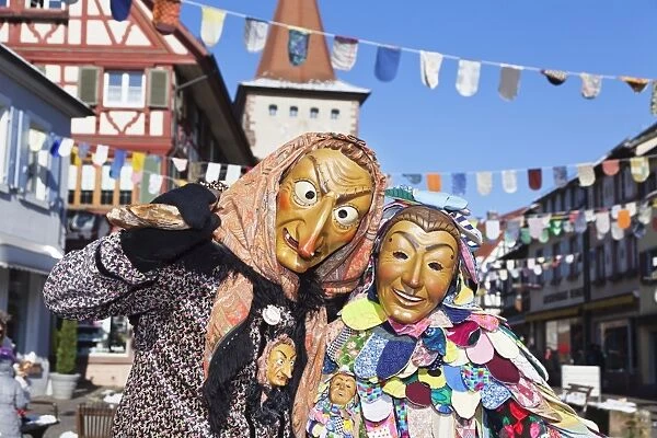 Couple in traditional costumes of Witch and Spattlehansel, Swabian Alemannic carnival, Gengenbach, Black Forest, Baden Wurttemberg, Germany, Europe