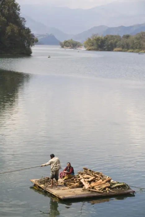 Framed Print : Couple on wooden raft with firewood, Fewa (Phewa) Lake, Pokhara, Nepal, Asia Framed Print : Couple on wooden raft with firewood, Fewa (Phewa) Lake, Pokhara, Nepal, Asia