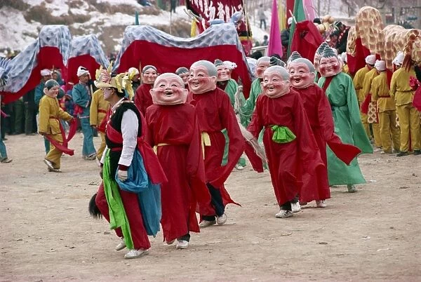 Crowds of costumed dancers celebrate Chinese New Year, Xining, Qinghai Province