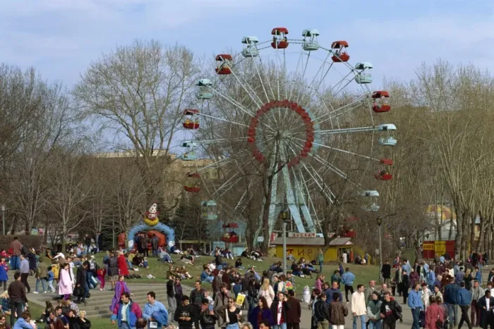 Framed Print : Crowds at a funfair with a big wheel during Earth Day Framed Print : Crowds at a funfair with a big wheel during Earth Day