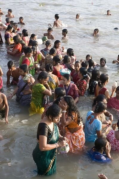 Crowds of people in front of Kali Temple bathing in the Hooghly River, Kolkata