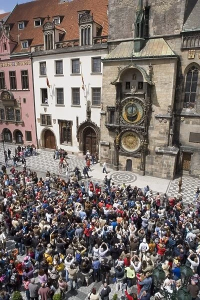 Crowds of tourists in front of the Astronomical clock, Town Hall, Old Town Square