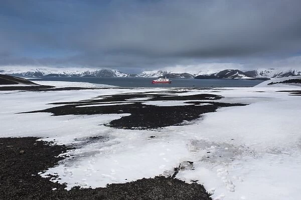 Cruise ship anchoring in the volcanic crater of Deception Island, South Shetland Islands, Antarctica, Polar Regions
