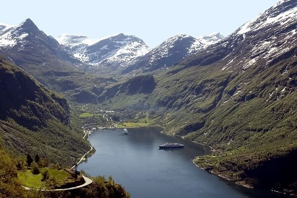 Cruise ships at head of Geiranger Fjord, UNESCO World Heritage Site, with the Dalsnibba snow peaks beyond, seen from the Eagles Nest viewpoint on the Ornevegen road, west coast, Norway