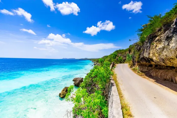 Framed Print : Crystal clear blue ocean side driving along the road on Bonaire, Netherlands Antilles Framed Print : Crystal clear blue ocean side driving along the road on Bonaire, Netherlands Antilles