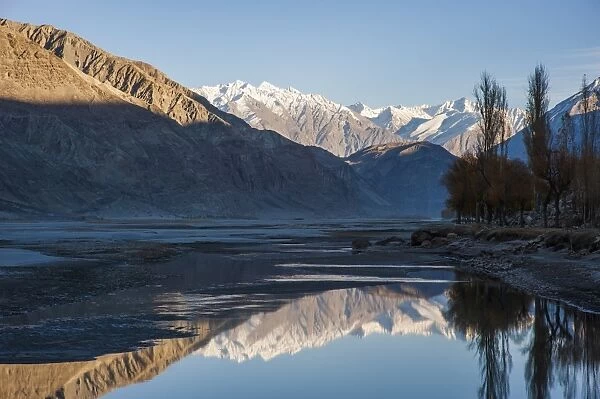 The crystal clear Shyok River creates a mirror image in the Khapalu valley near Skardu