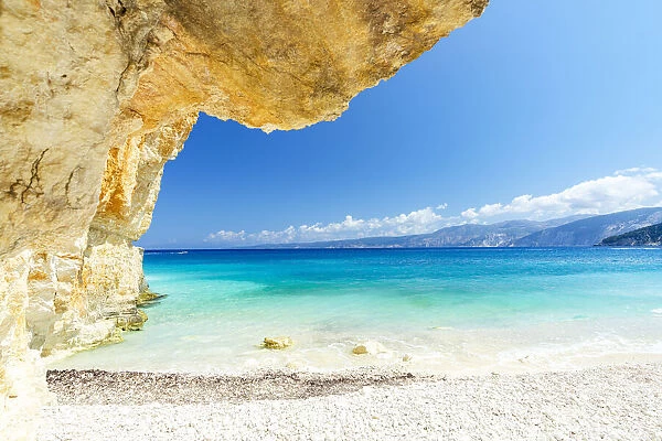 Crystal sea surrounded by limestone cliffs and white pebbles, Fteri Beach, Kefalonia, Ionian Islands, Greek Islands, Greece, Europe