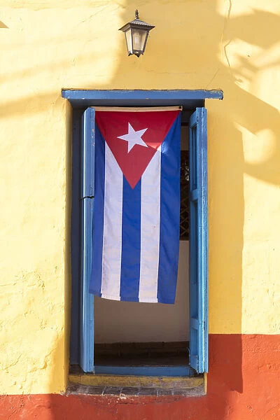 Cuban Flag in doorway, Trinidad, UNESCO World Heritage Site, Sancti Spiritus, Cuba