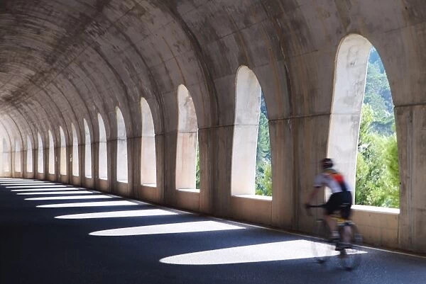 Cyclist in Alpine Tunnel, Europe