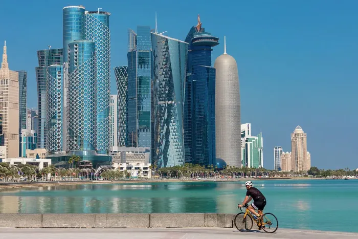Framed Print : A Cyclist against the West Bay Skyline, Doha, Qatar, Middle East Framed Print : A Cyclist against the West Bay Skyline, Doha, Qatar, Middle East
