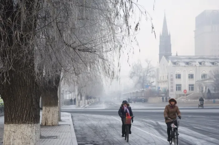 Framed Print : Cyclists in a winter wonderland and Catholic church in Jilin City, Jilin Province Framed Print : Cyclists in a winter wonderland and Catholic church in Jilin City, Jilin Province
