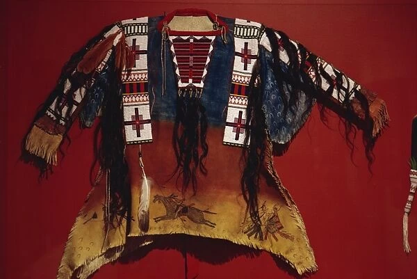 Dakota shirt, reworked, painted buckskin, with bull hair, eagle and hawk feathers