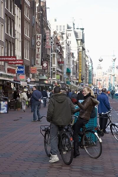Damrak, a busy thoroughfare in the centre of the city, Amsterdam, Netherlands, Europe