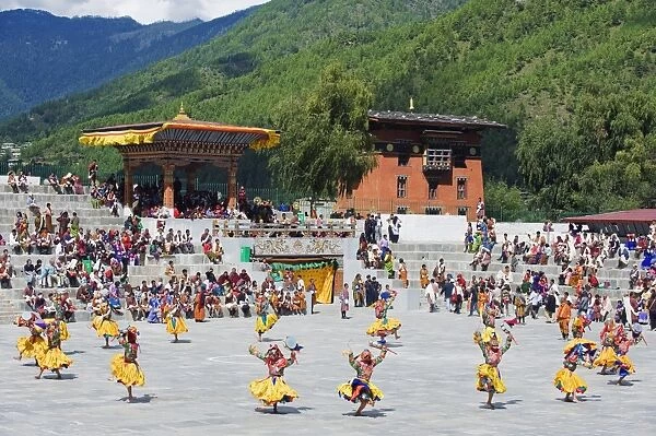 Dancers in traditional costume, Autumn Tsechu (festival) at Trashi Chhoe Dzong