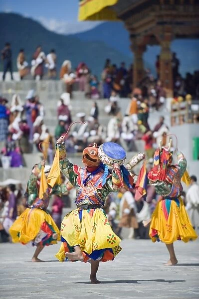 Dancers in traditional costume, Autumn Tsechu (festival) at Trashi Chhoe Dzong