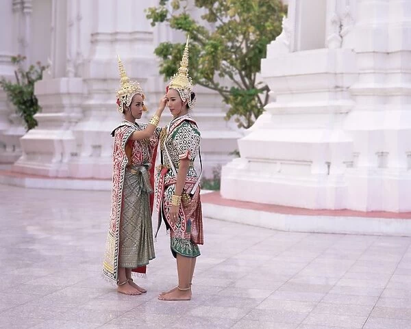 Two dancers in traditional Thai classical dance costume