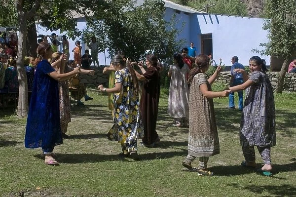 Dancing guests at wedding at Pamiris, Bartang Valley, Tajikistan, Central Asia, Asia