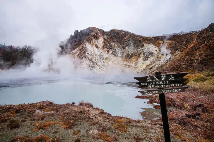 Framed Print : Danger sign in front of volcanic field and steaming pond in Noboribetsu, Hell Valley, Hokkaido, Japan, Asia Framed Print : Danger sign in front of volcanic field and steaming pond in Noboribetsu, Hell Valley, Hokkaido, Japan, Asia