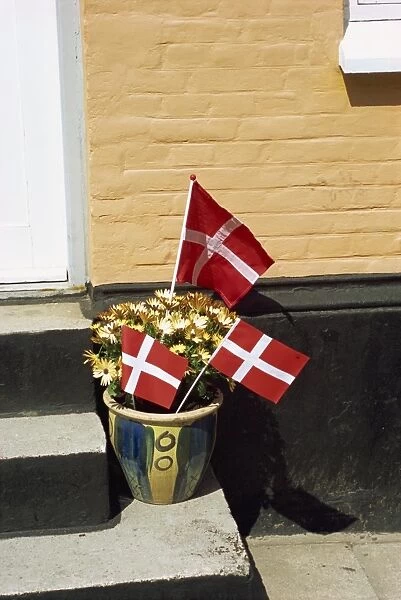 Danish flags outside a house in Aeroskobing, Aero, Denmark, Scandinavia, Europe