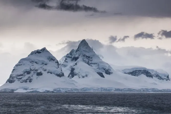 Framed Print : Dark clouds over the mountains and glaciers of Port Lockroy research station, Antarctica, Polar Regions Framed Print : Dark clouds over the mountains and glaciers of Port Lockroy research station, Antarctica, Polar Regions