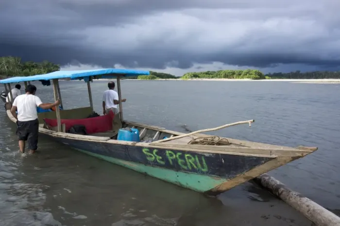 Framed Print : Dark clouds and tourist boat on the Manu river, Manu National Park, UNESCO World Heritage Site, Peru, South America Framed Print : Dark clouds and tourist boat on the Manu river, Manu National Park, UNESCO World Heritage Site, Peru, South America