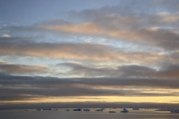 Dawn clouds and icebergs, Antarctic Peninsula, Antarctica, Polar Regions