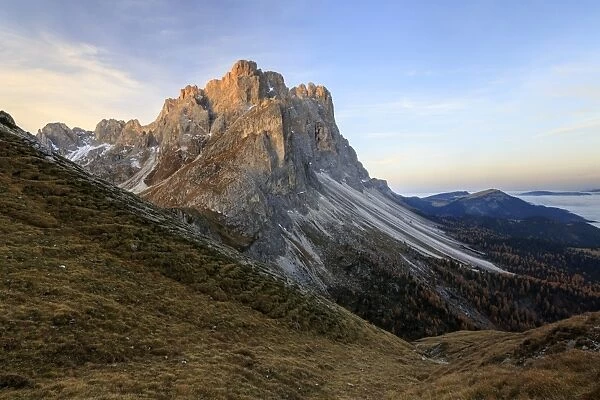 Dawn illuminates the peaks of Forcella De Furcia, Funes Valley, South Tyrol, Dolomites