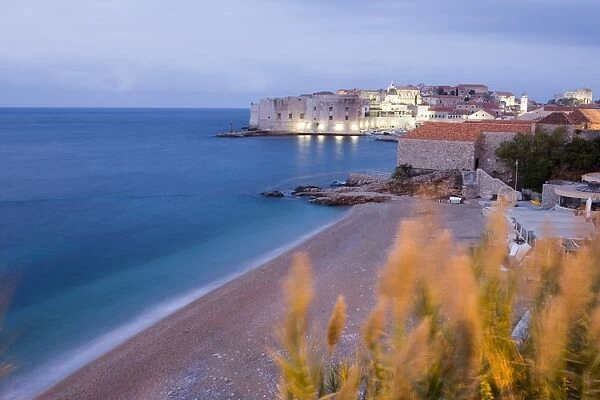 Dawn view of beach, harbour and waterfront of Dubrovnik Old Town, Dalmatia