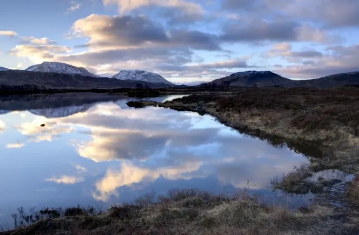 Framed Print : Dawn view of Loch Ba reflecting the sky and distant snow-capped mountains Framed Print : Dawn view of Loch Ba reflecting the sky and distant snow-capped mountains