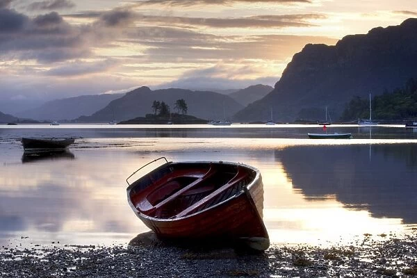 Dawn view at low tide with rowing boat in foreground, Plokton, near Kyle of Lochalsh