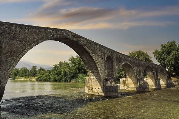 Day view of historic stone bridge of Arta above the Arachthos River, Arta, Epirus region, Greece, Europe