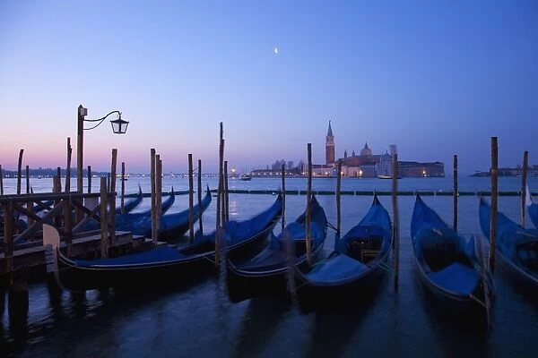 Daybreak view of gondolas from Piazzetta San Marco to Isole of San Giorgio Maggiore