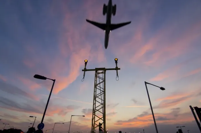 Framed Print : DC9 aircraft approaching over runway landing light gantries at sunset, London, England, United Kingdom, Europe Framed Print : DC9 aircraft approaching over runway landing light gantries at sunset, London, England, United Kingdom, Europe