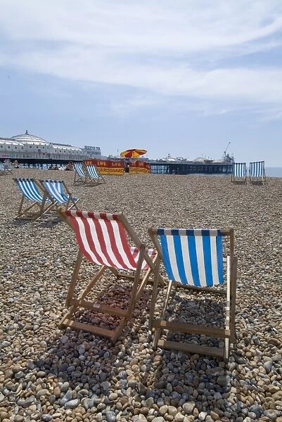 Deck chairs and pier, Brighton Beach, Brighton, Sussex, England, United Kingdom, Europe