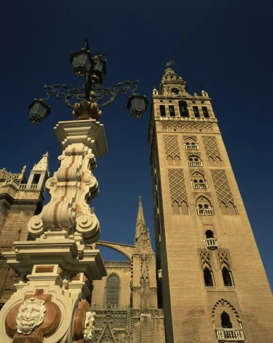 Framed Print : Decorative lamps and the Giralda tower in the city of Seville Framed Print : Decorative lamps and the Giralda tower in the city of Seville