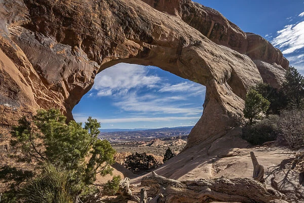 Desert landscape viewed through Partition Arch, Arches National Park, Utah