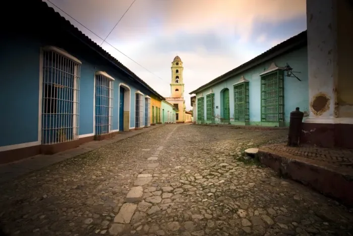 Framed Print : Deserted cobbled street looking towards the bell tower of the Inglesia y Convento de San Francisco off Plaza Major, Trinidad, Cuba, West Indies Framed Print : Deserted cobbled street looking towards the bell tower of the Inglesia y Convento de San Francisco off Plaza Major, Trinidad, Cuba, West Indies