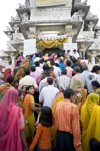 Devotees queueing to do puja at Kankera festival, where donations of foods are made for the poor